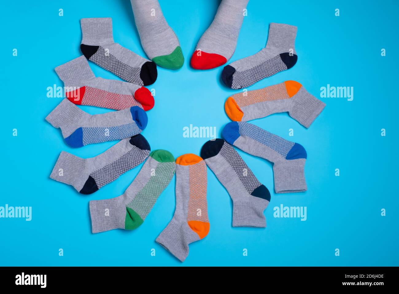 colored socks in a around on a blue background Stock Photo