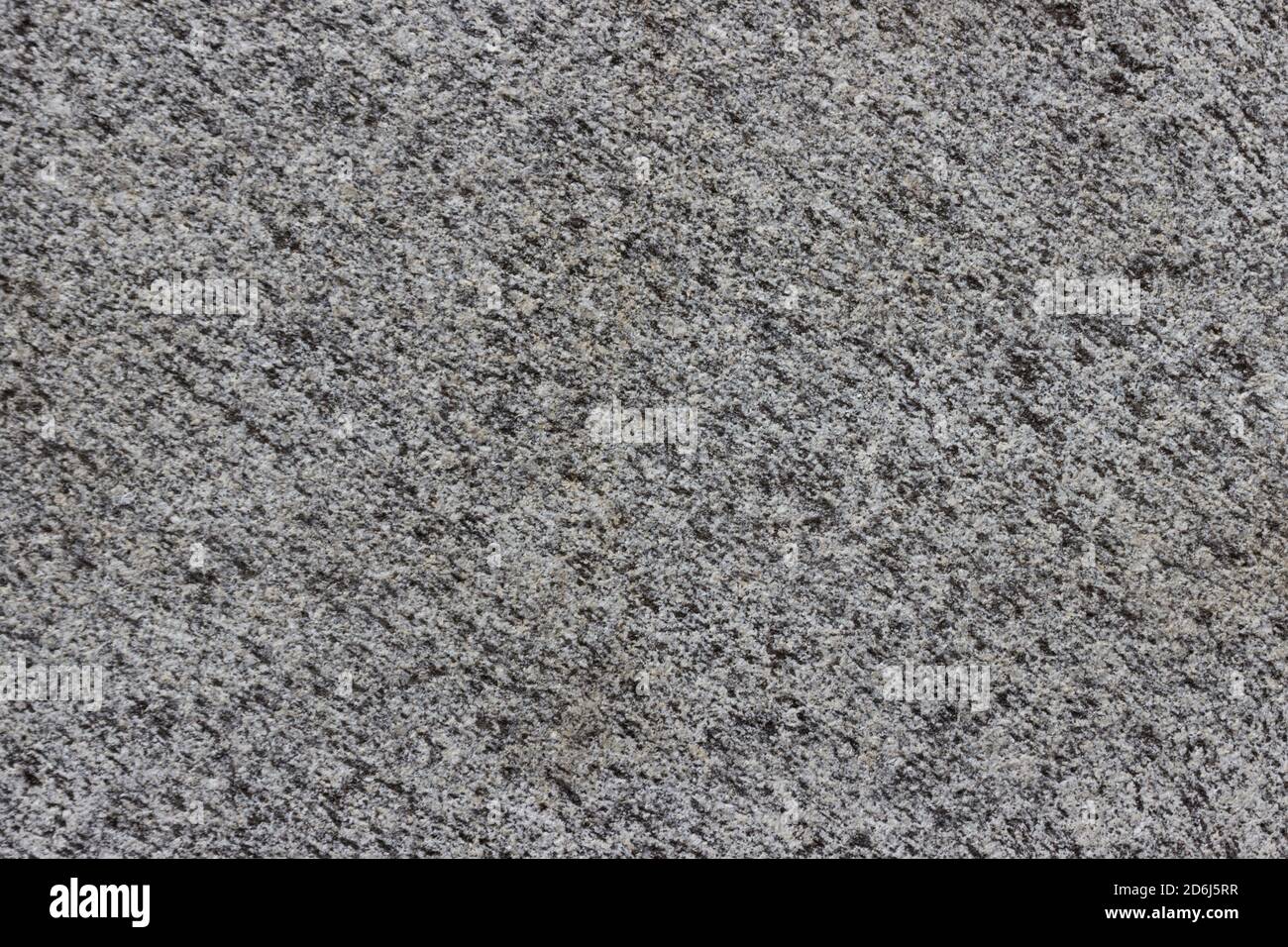 The texture of a natural stone slab from polished granite. Stock Photo