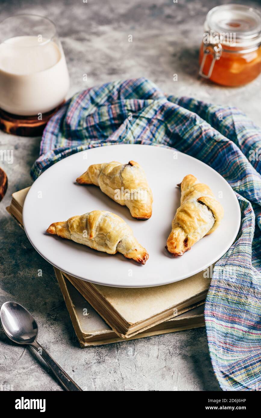 Croissants stuffed with nuts and chocolate for breakfast Stock Photo