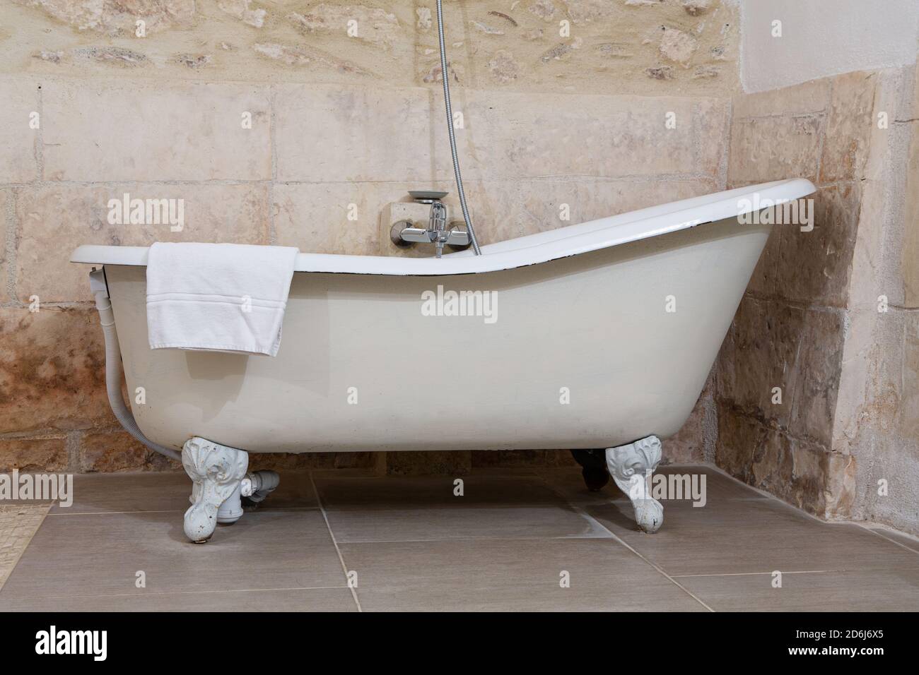 Antique bathtub with feet in a room Stock Photo Alamy