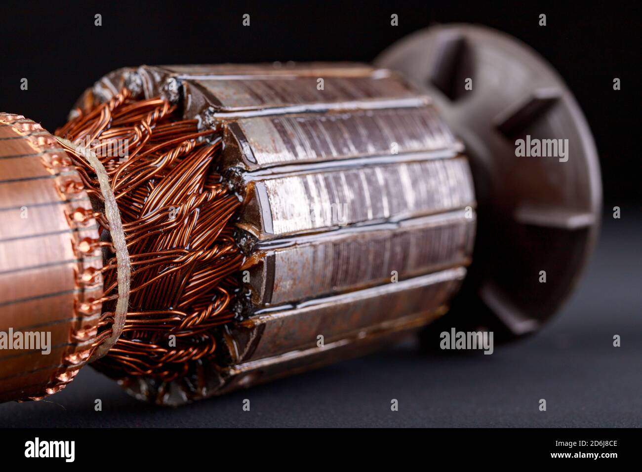 Electric motor rotor on a dark table. Accessories for overhaul and repair of engines. Black