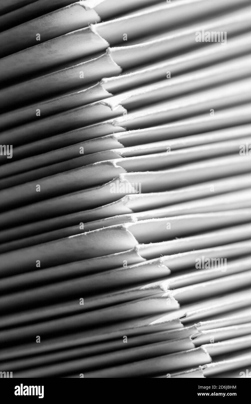 A macro shot of a stack of envelopes filled with letters, for The Big Send by Vote Forward, creates an abstract design Stock Photo