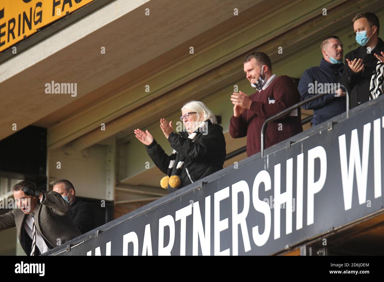 Burslem, Staffordshire, UK. 17th October, 2020. Port Vale Chairman Carol Ann Shanahan OBE applauds the Port Vale team from the pitch after their 1- victory over Salford City in League 2. Carol watch the game from the directors box and the game was played behind closed doors due to the coronavirus pandemic. Stock Photo