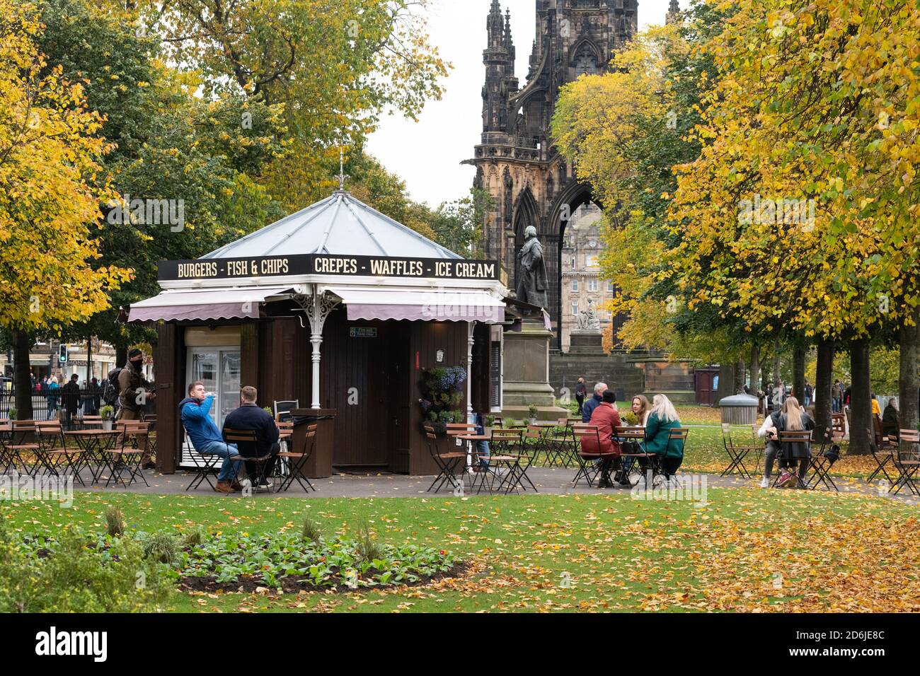 People sitting outside at a cafe in Edinburgh during local measures in Scotland's central belt with pubs and restaurants closed October 17 2020 Stock Photo