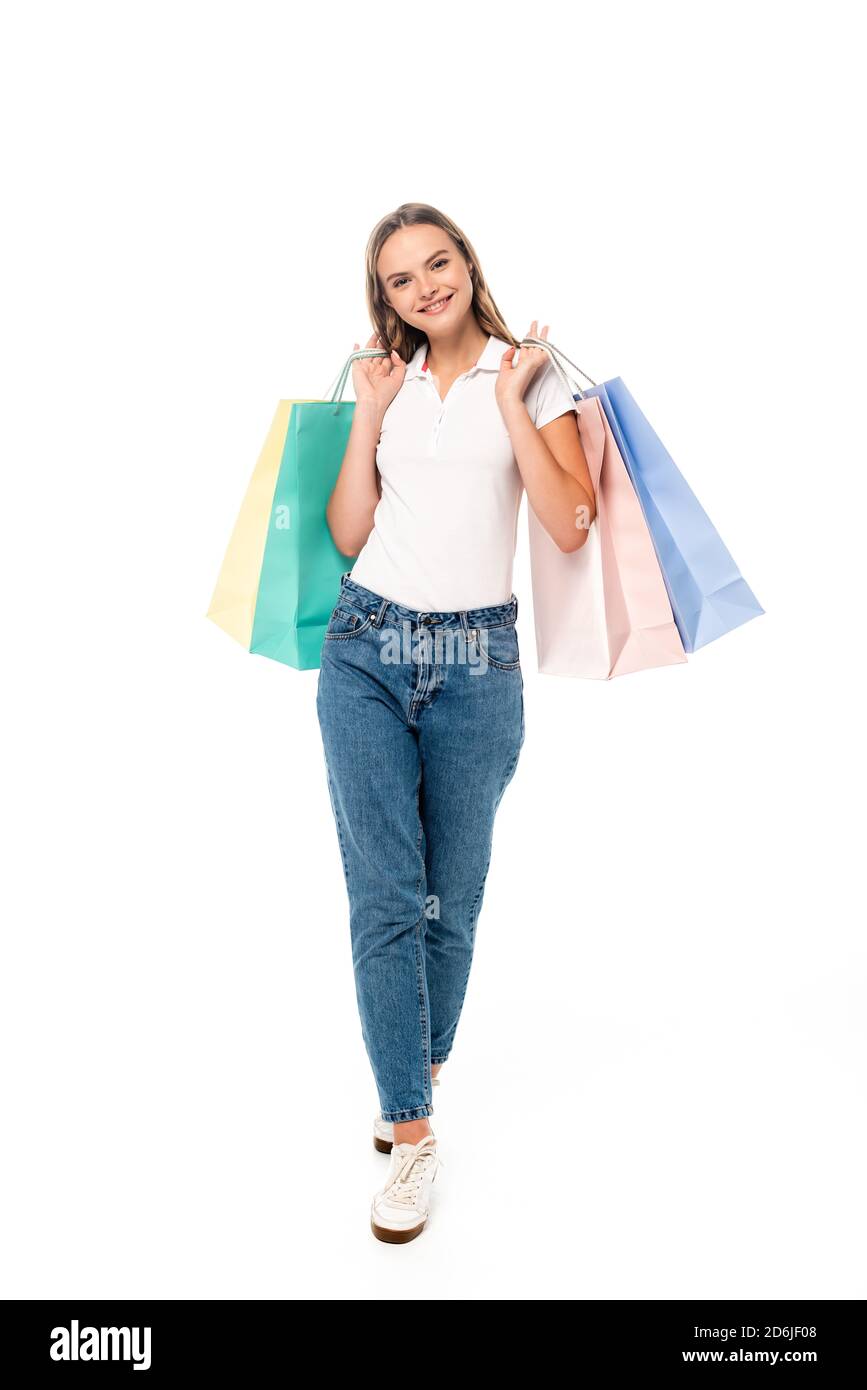 cute teenage girl in jeans clothes with shopping bags isolated on white  background Stock Photo - Alamy