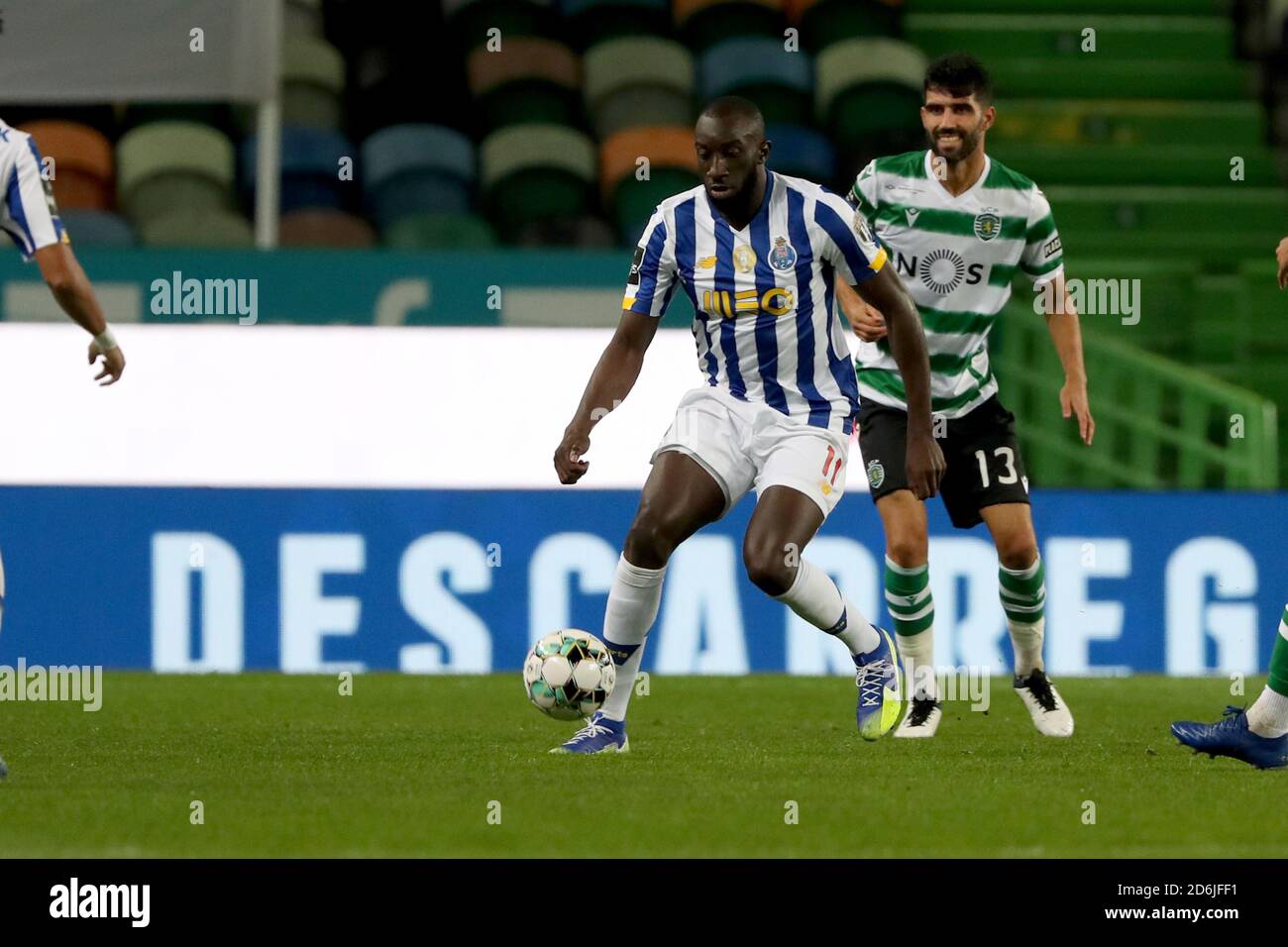 Lisbon, Portugal. 17th Oct, 2020. Marega of FC Porto (L) vies with Luis Neto of Sporting CP during the Portuguese League football match between Sporting CP and FC Porto at Jose Alvalade stadium in Lisbon, Portugal on October 17, 2020. Credit: Pedro Fiuza/ZUMA Wire/Alamy Live News Stock Photo