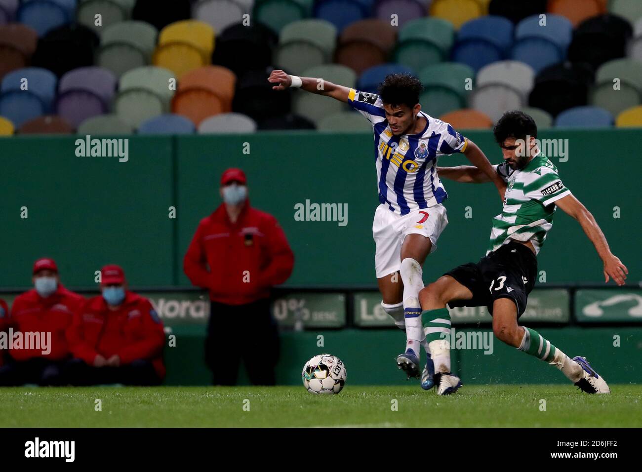 Lisbon, Portugal. 17th Oct, 2020. Luis Diaz of FC Porto (L) vies with Luis Neto of Sporting CP during the Portuguese League football match between Sporting CP and FC Porto at Jose Alvalade stadium in Lisbon, Portugal on October 17, 2020. Credit: Pedro Fiuza/ZUMA Wire/Alamy Live News Stock Photo