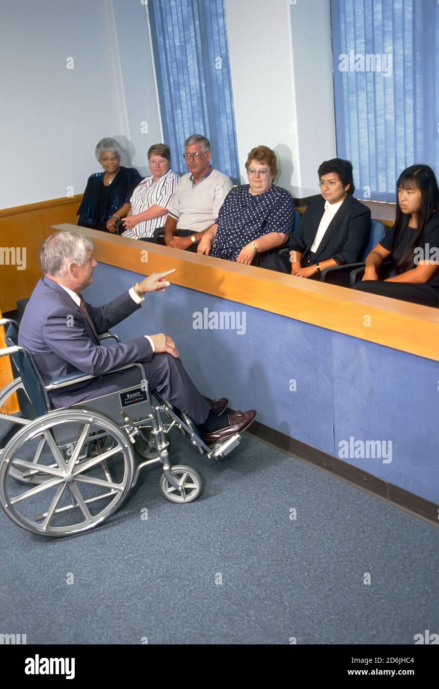 Lawyer in wheelchair adresses a court room jury Stock Photo