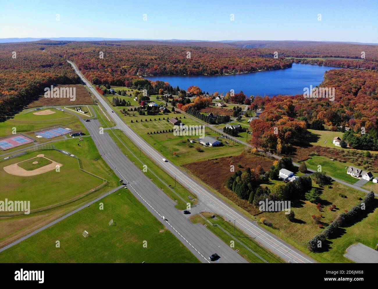 The aerial view of the stunning fall foliage and the Bear Creek Lake on