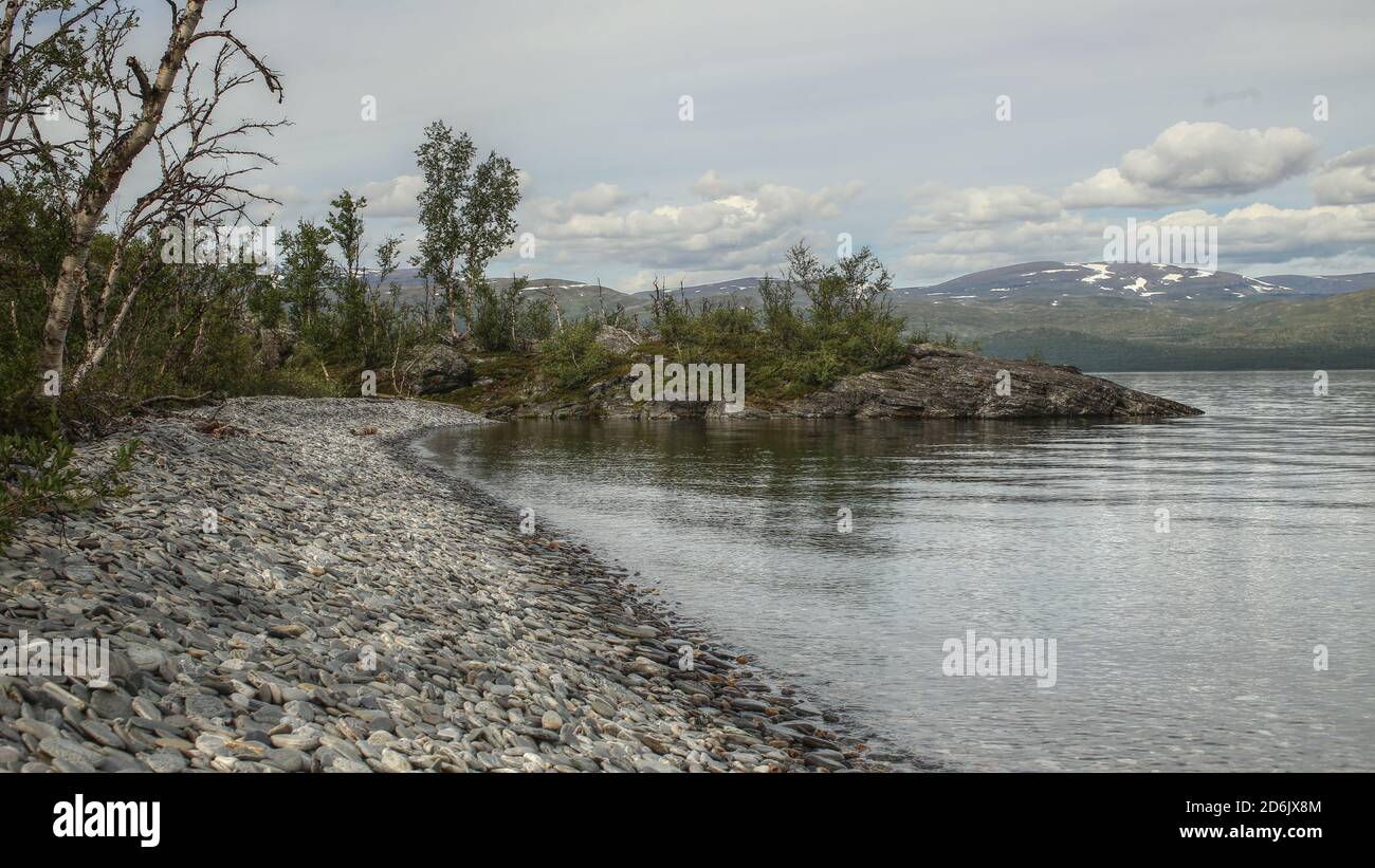 Gravel beach at Gohkasjohka delta at lake Tornetrask, Lapland. Stock Photo