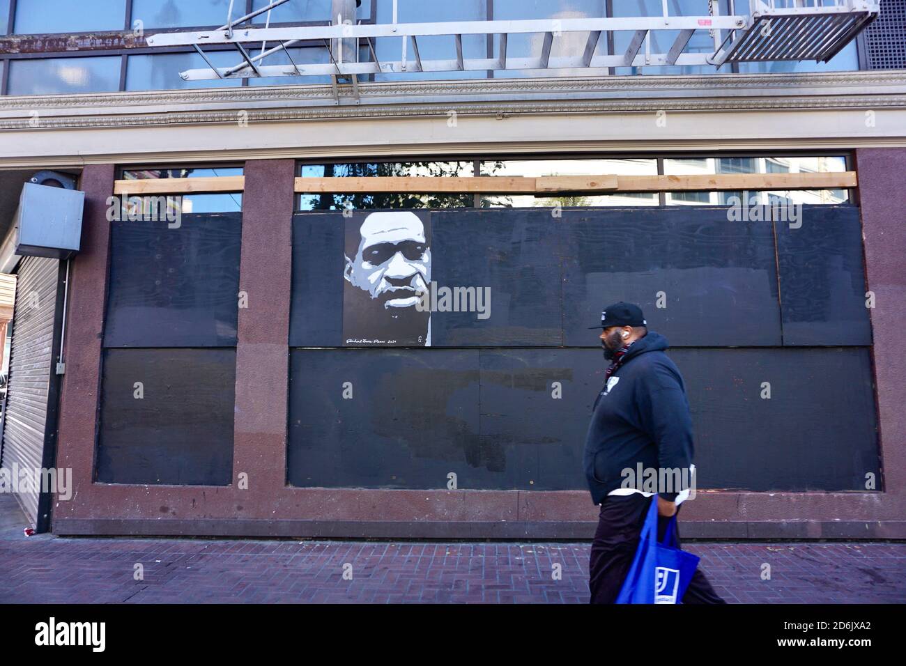 October 17, 2020. Painting of George Floyd's face, Black Lives Matter street art, on boarded up windows. Market Street, San Francisco, California, USA. Stock Photo