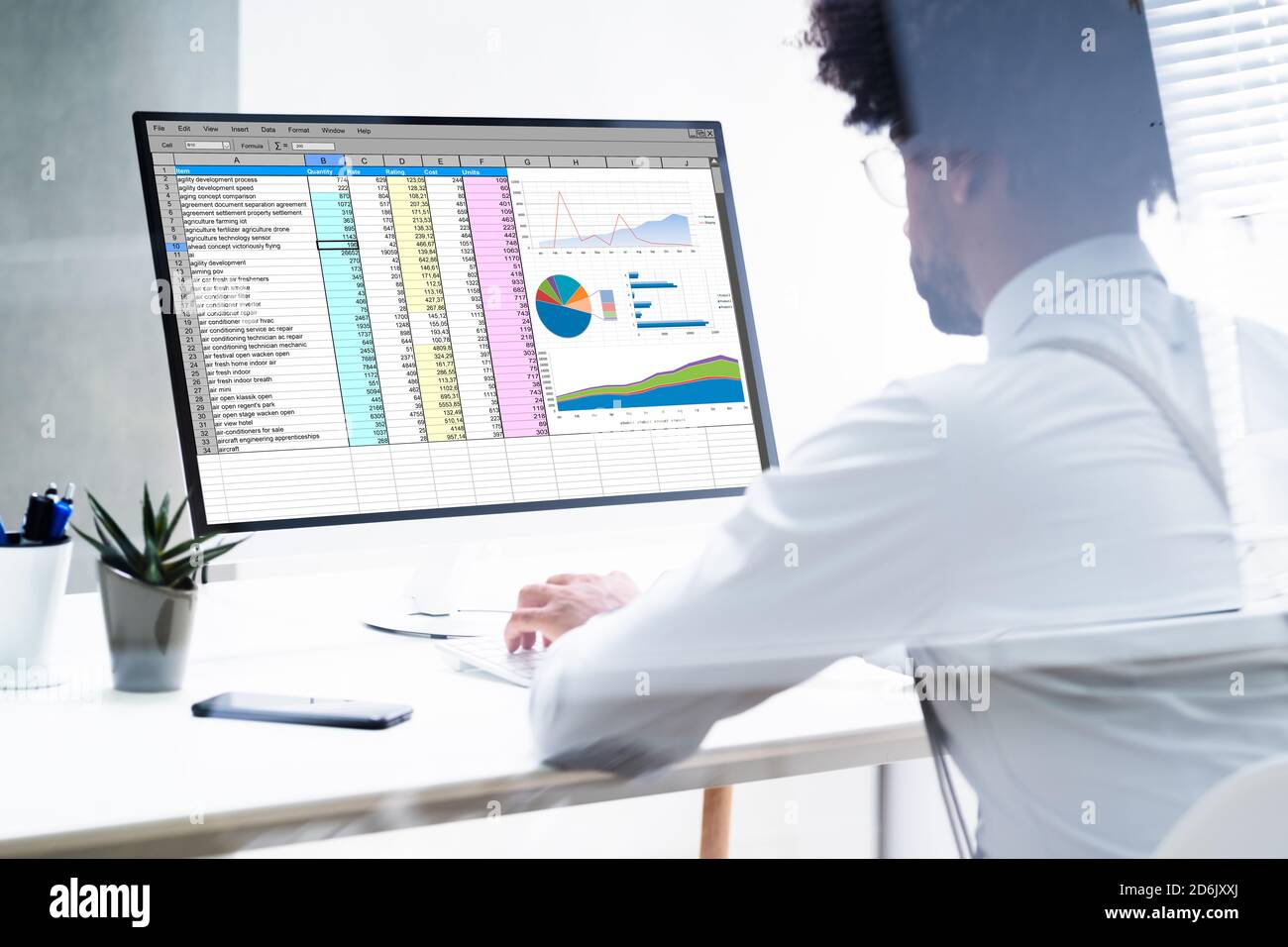 African American Hand Using Computer For Spreadsheet Data Work Stock Photo