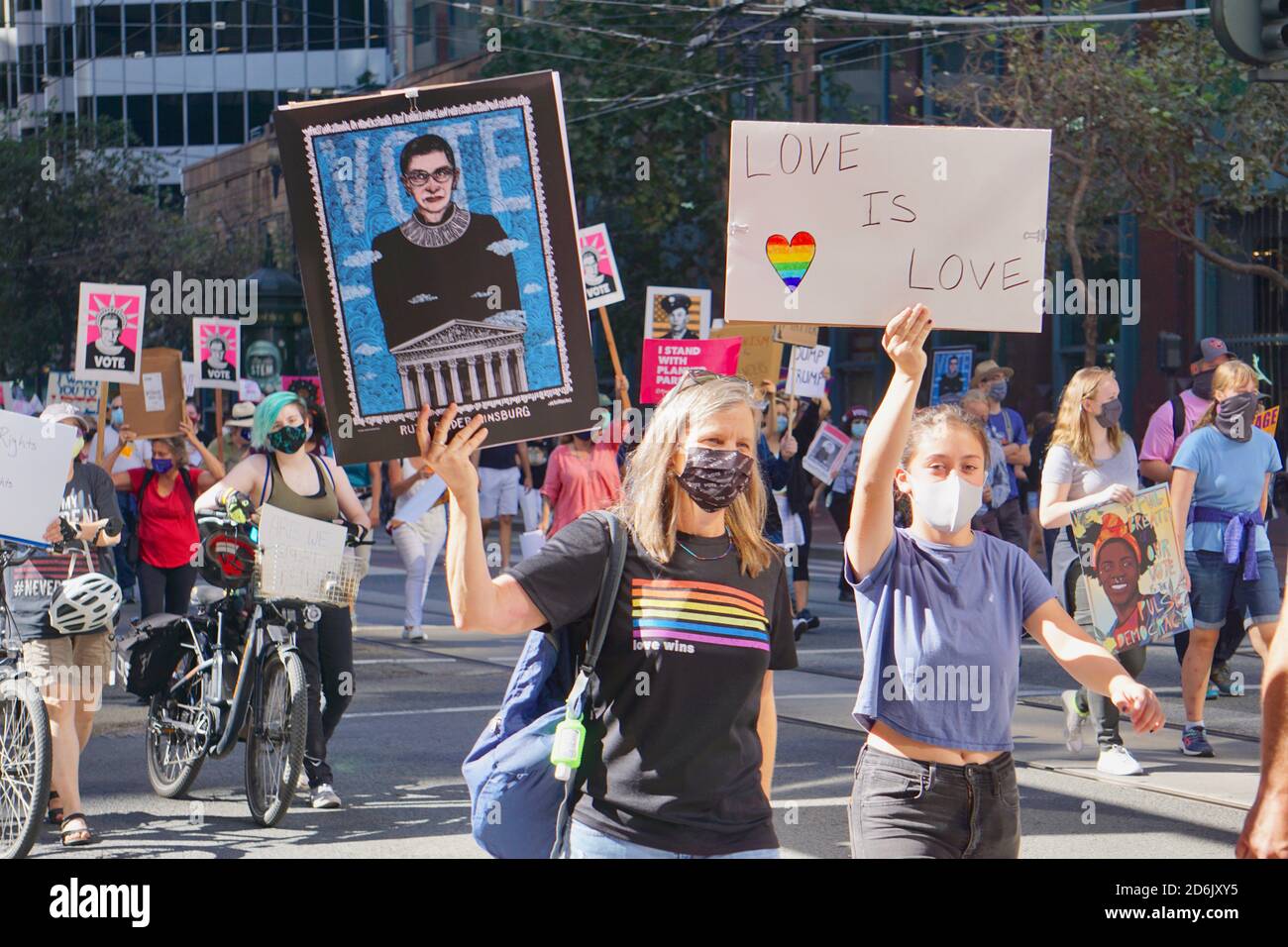 October 17, 2020. LGBT protestors at San Francisco Women's March holding a Ruth Bader Ginsberg sign before the USA Presidential Election. Stock Photo