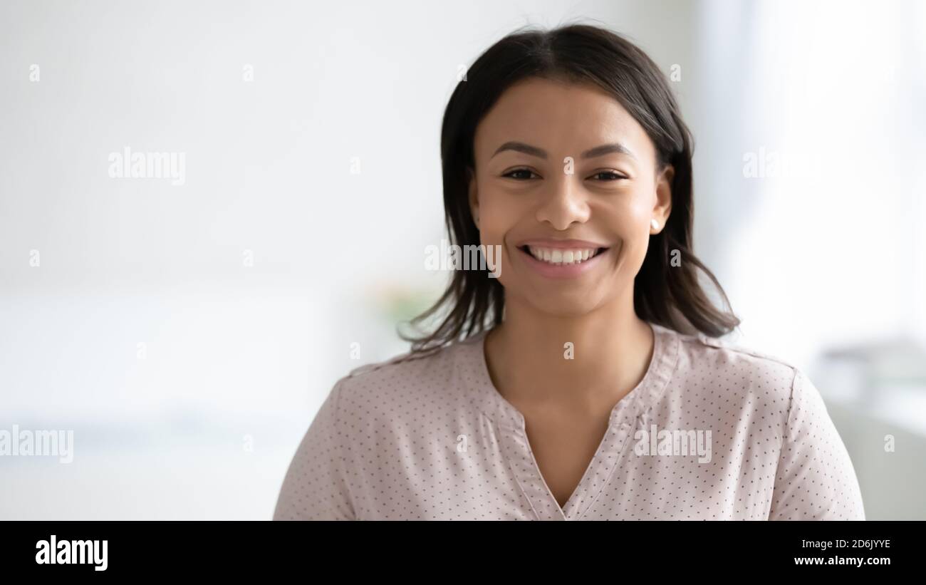 Headshot portrait of smiling biracial woman posing Stock Photo - Alamy