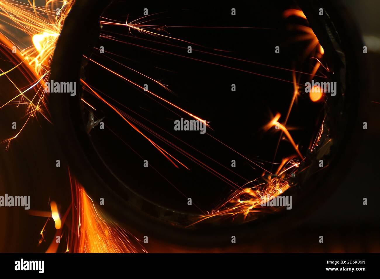 Cutting a metal pipe with angle grinder Stock Photo Alamy