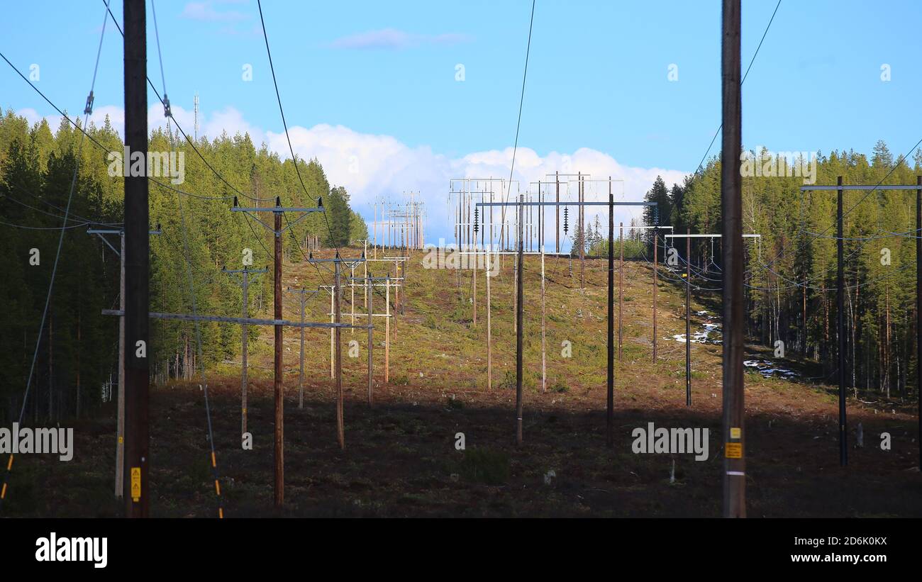 Power lines leading over Finnberget in Vasterbotten, Northern Sweden. Stock Photo