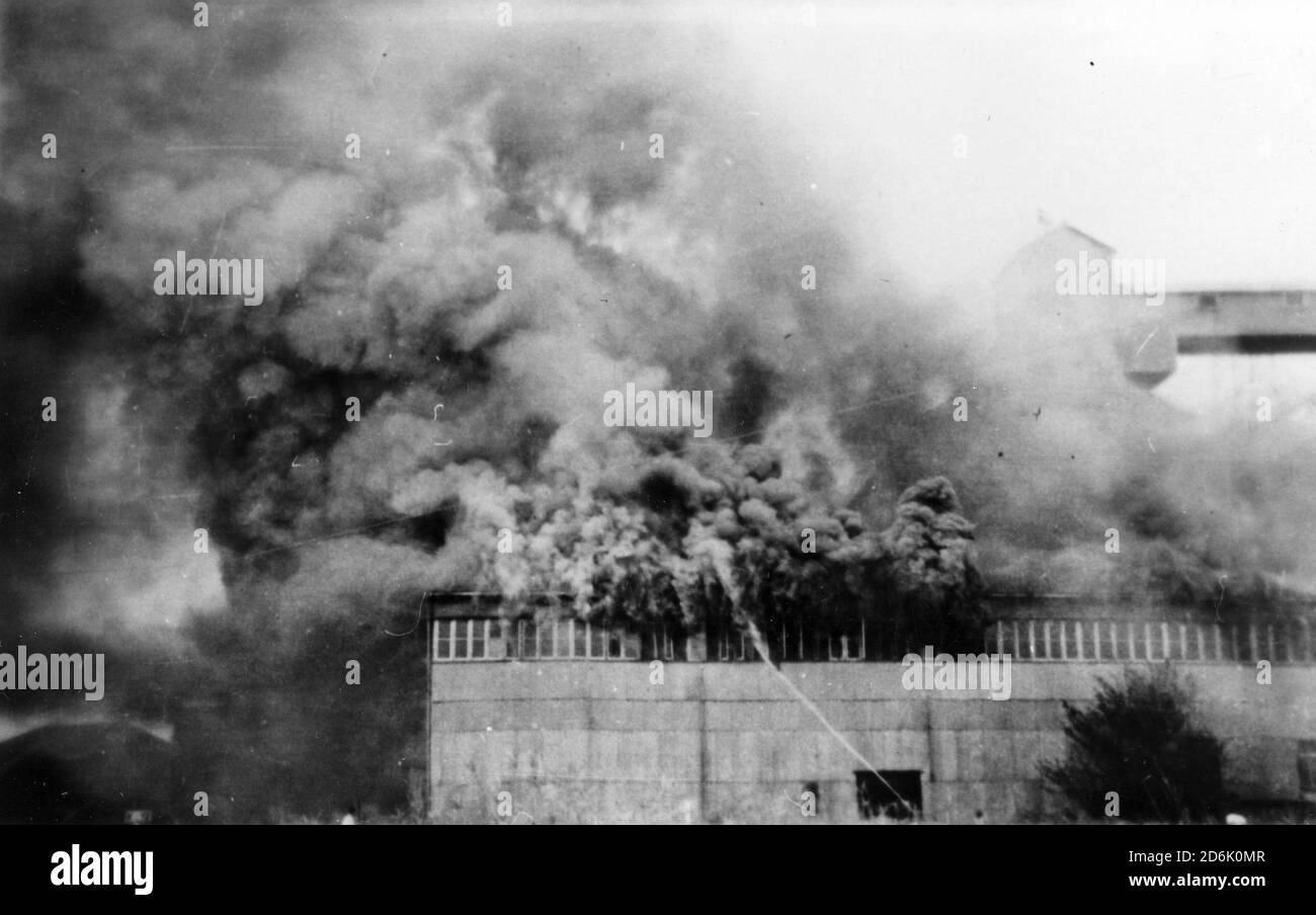 Kingaroy, Qld, Australia, 1951 Fire destroys a storage shed at the