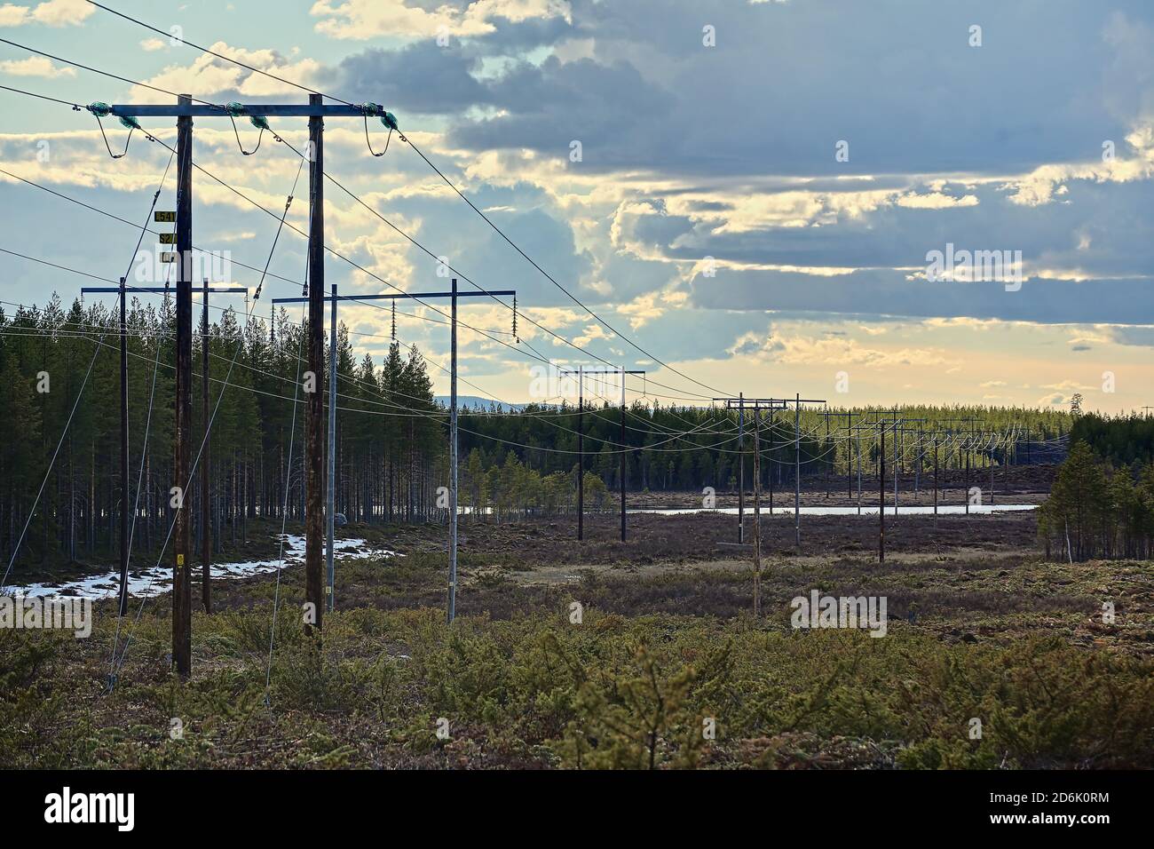 Power lines over lake Katatjarn in Vasterbotten, Northern Sweden. Stock Photo