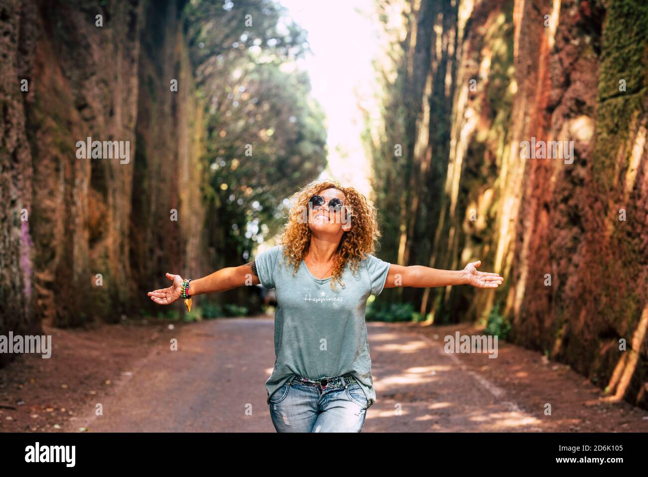 Happiness and freedom with beautiful people enjoying the outdoor leisure activity in scenic place - concept of travel and tourism holiday vacation - h Stock Photo