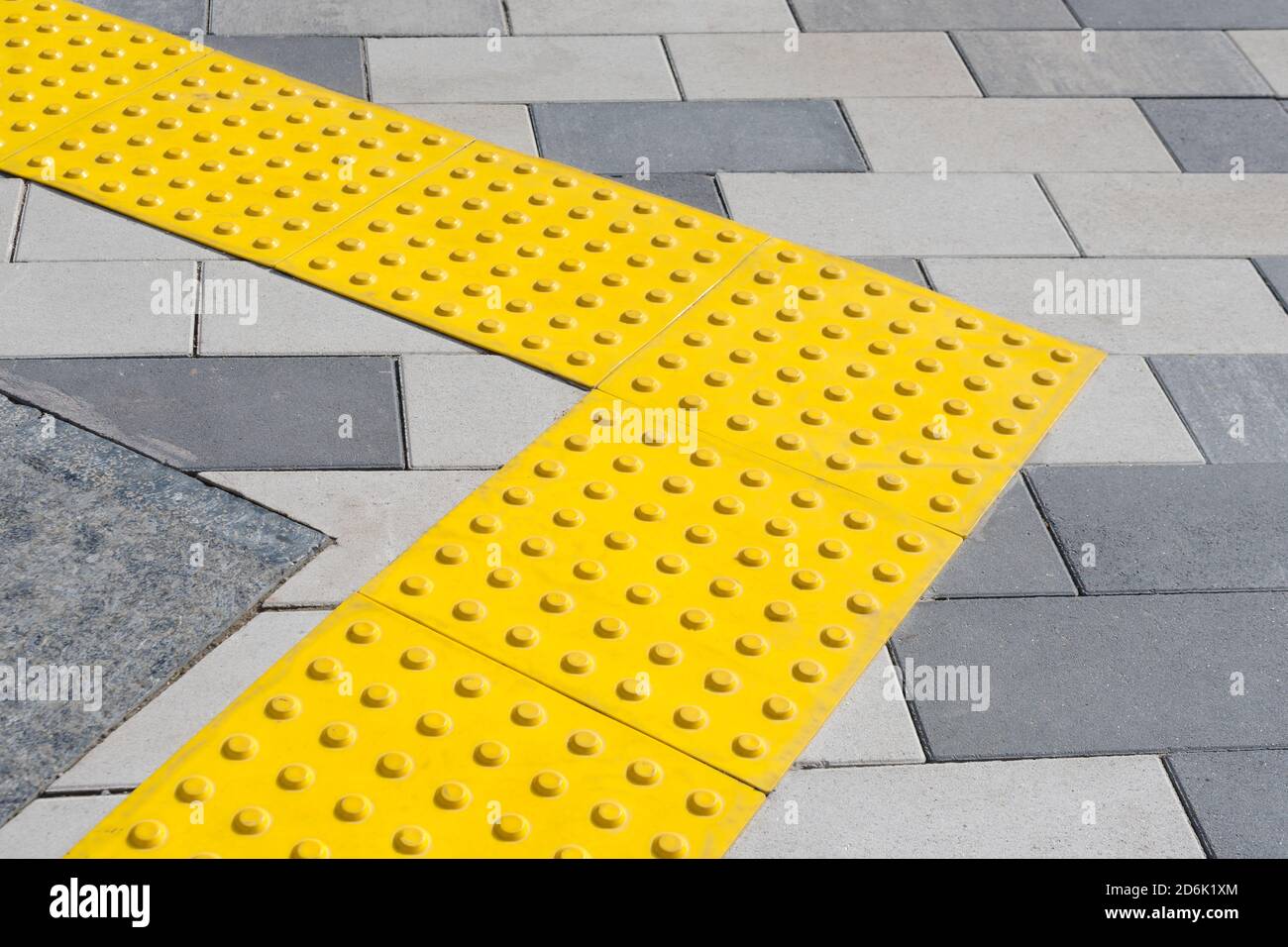 Yellow blocks of tactile paving for blind handicap. Braille blocks