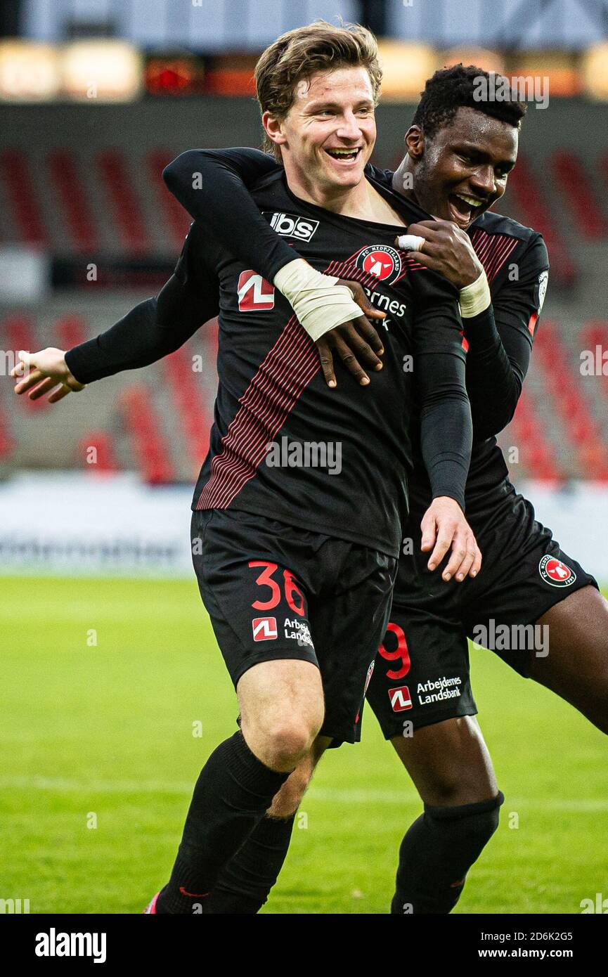 Herning, Denmark. 17th Oct, 2020. Anders Dreyer (36) of FC Midtjylland  scores for 2-1 and celebrates with Sory Kaba (9) during the 3F Superliga  match between FC Midtjylland and Odense Boldklub at