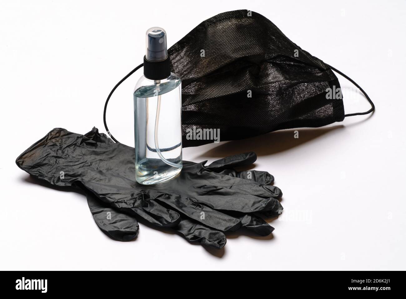 Disposable blue medical face mask, rubber latex gloves and alcohol hand