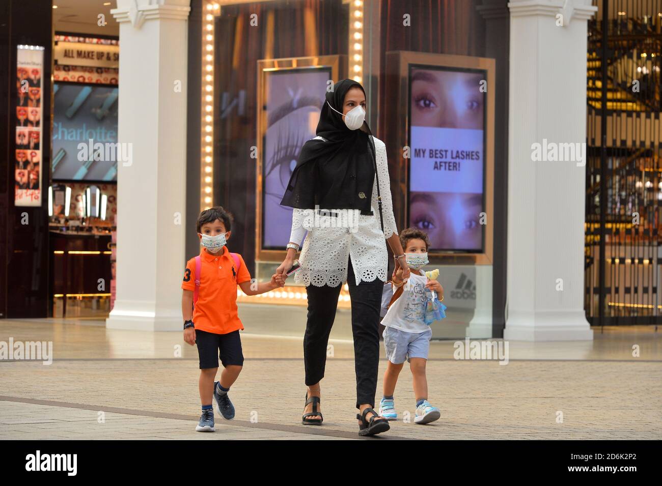 Kuwait City, Kuwait. 17th Oct, 2020. People wearing face masks walk at a shopping mall in Farwaniya Governorate, Kuwait, Oct. 17, 2020. Kuwait reported 739 new COVID-19 cases and four more deaths, raising the tally of infections to 115,483 and the death toll to 694 in the country, the Health Ministry said in a statement. Credit: Asad /Xinhua/Alamy Live News Stock Photo