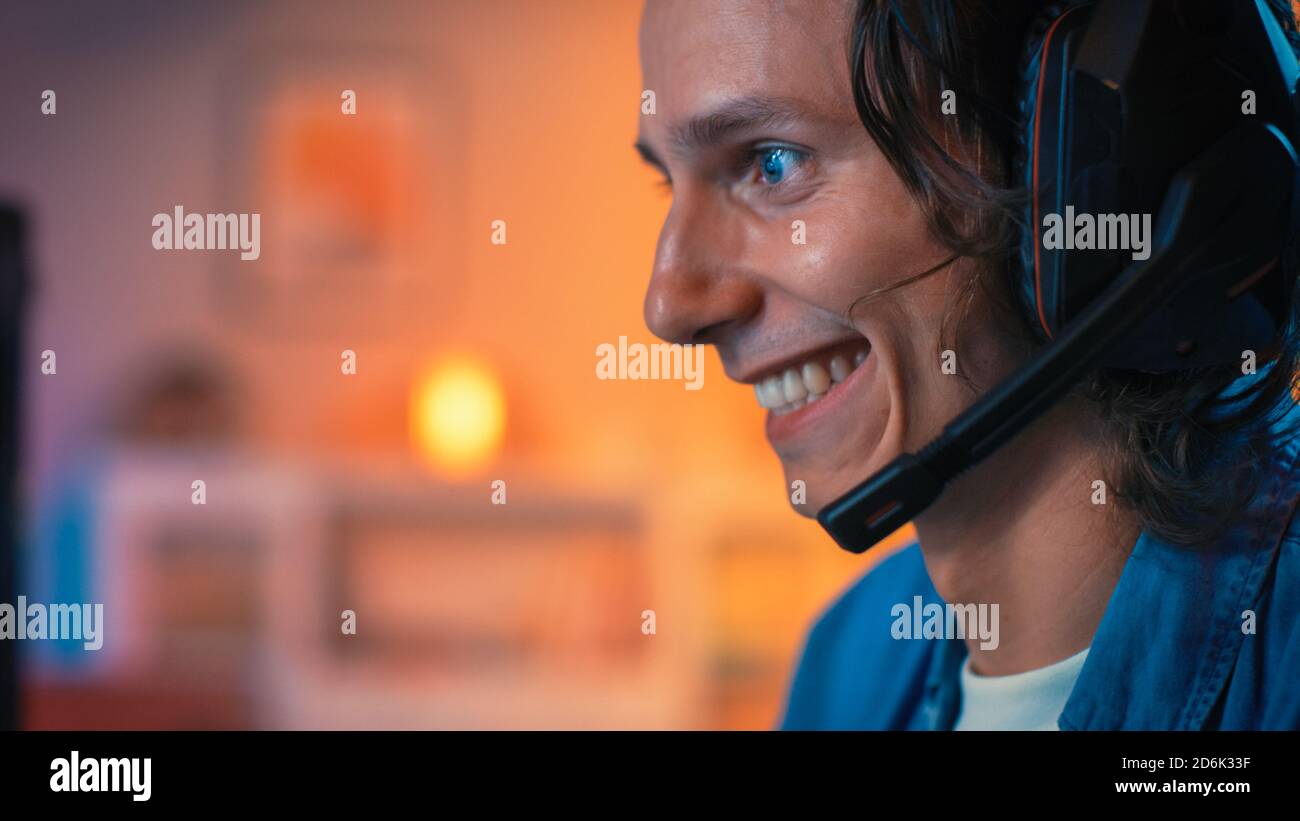 Gamer Using Mic Close Up of an Excited Gamer in Headset with a Mic Playing Online Video ...