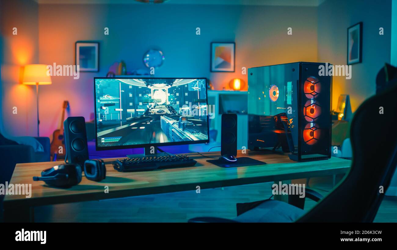 Powerful Personal Computer Gamer Rig with FirstPerson Shooter Game on Screen. Monitor Stands on