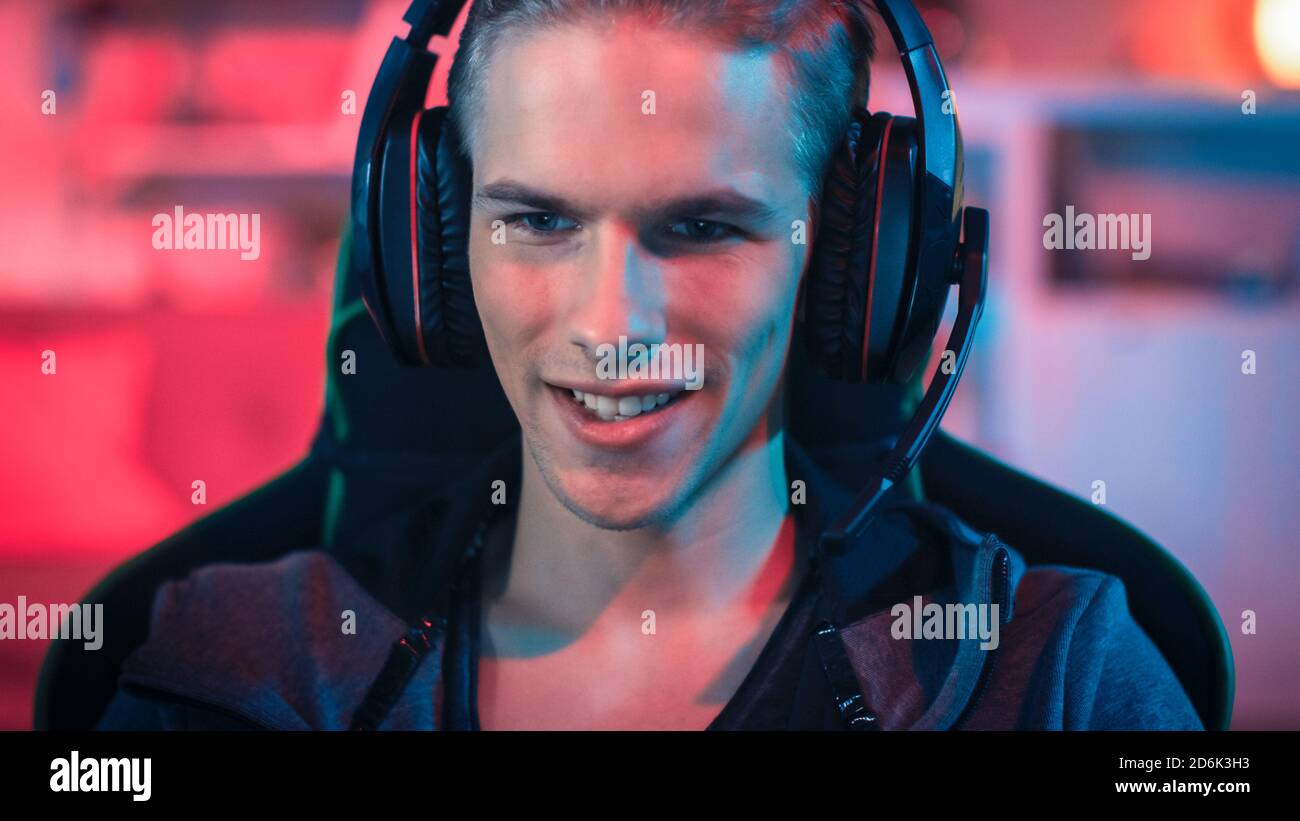 Gamer Using Mic Gamer in Headset with a Mic Playing Online Video Game on His Personal ...