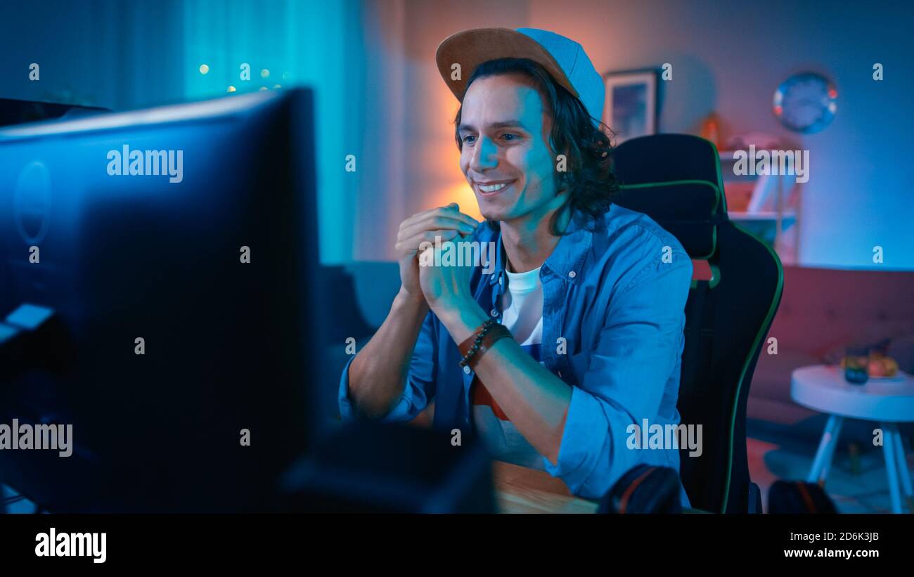 Handsome Excited Young Man Watching an Action Video on a Computer. He ...