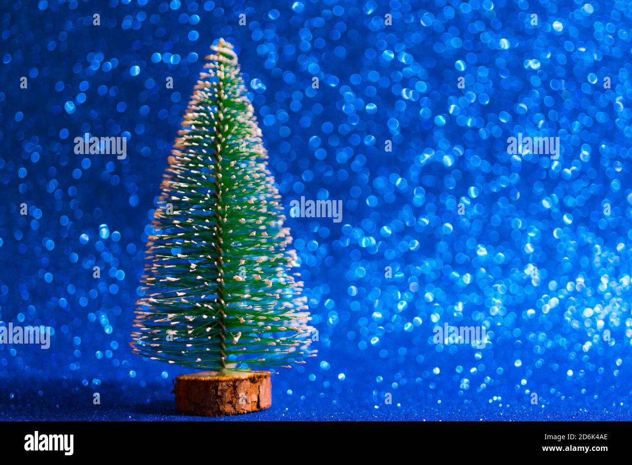 Christmas tree on shiny blue background - perfect for background or ...