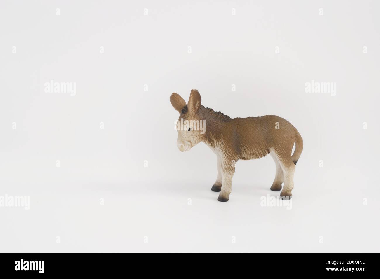 toy miniature donkey, isolated plastic toy donkey on white background