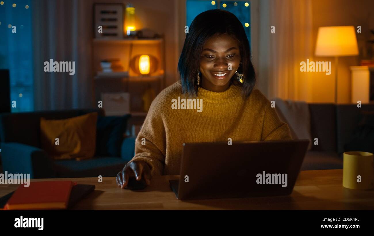 Portrait of Beautiful Smiling African American Girl Using Laptop while ...
