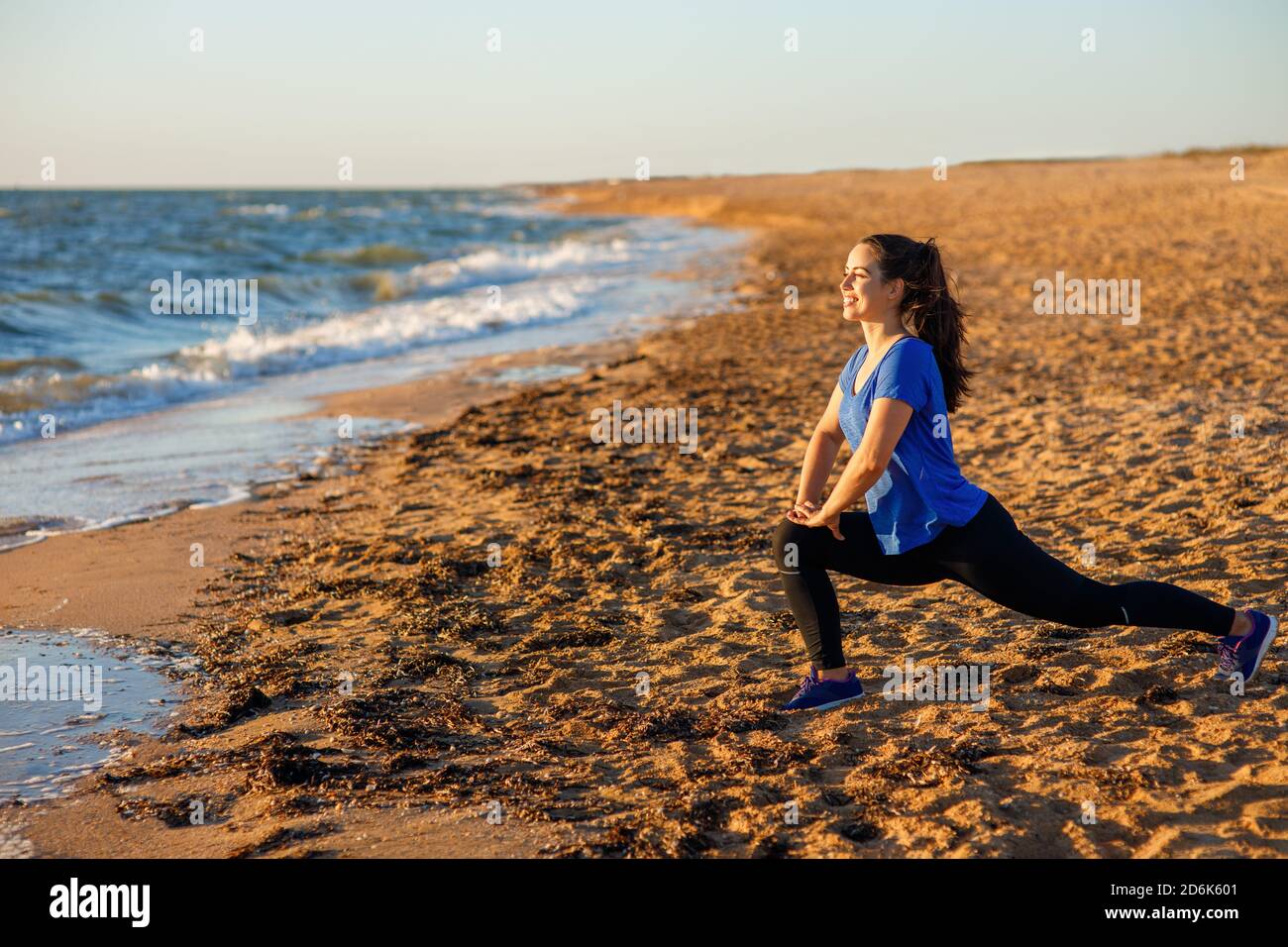 fitness woman doing lunge exercises Stock Photo