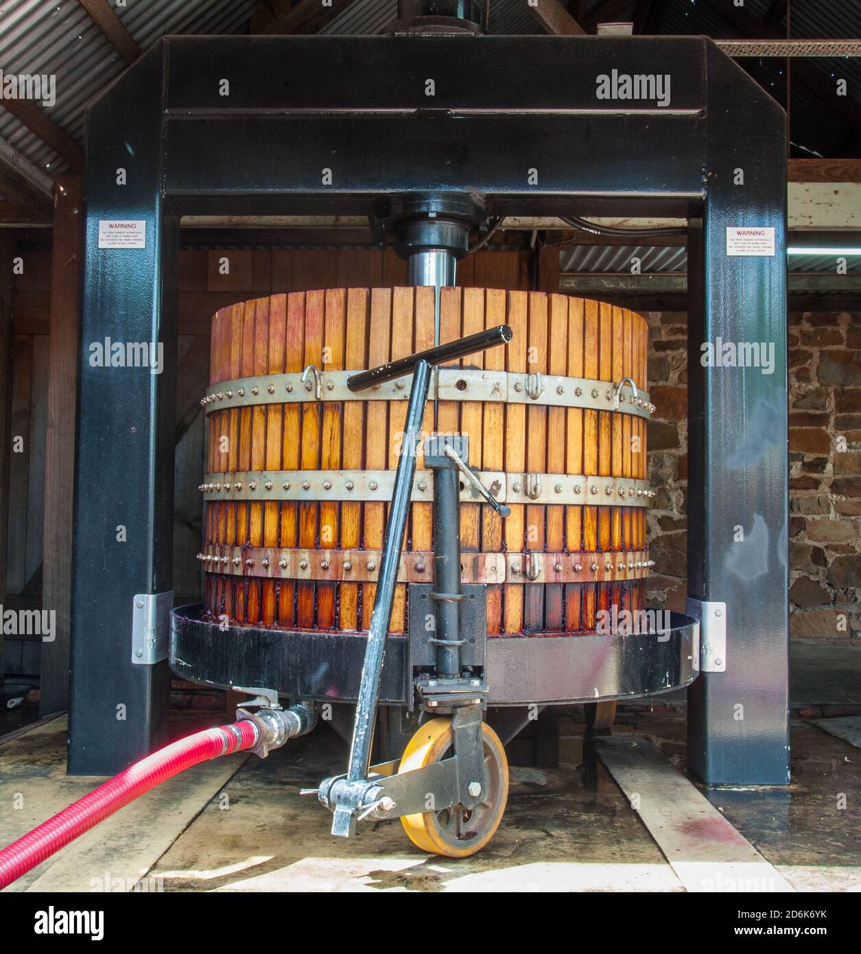 Large basket press used to press red wine grapes in a traditional