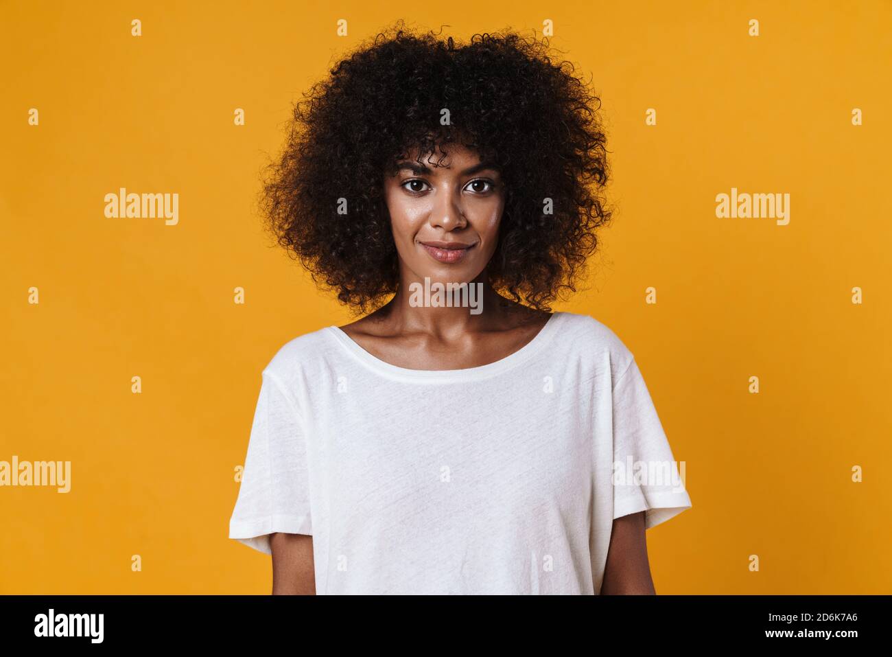 Image of happy african american girl smiling and looking at camera ...