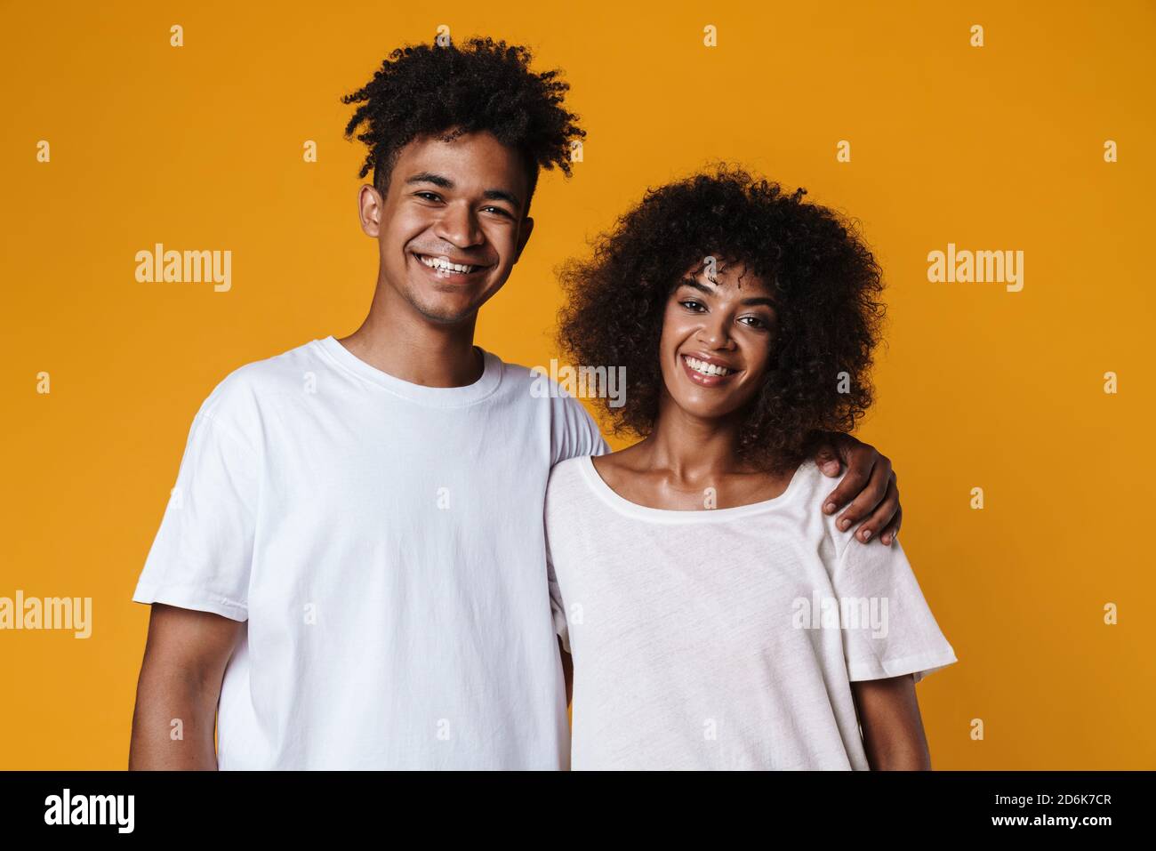 Image of happy african american couple hugging and smiling at camera ...