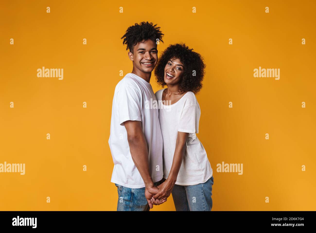 Image of happy african american couple smiling and holding hands ...