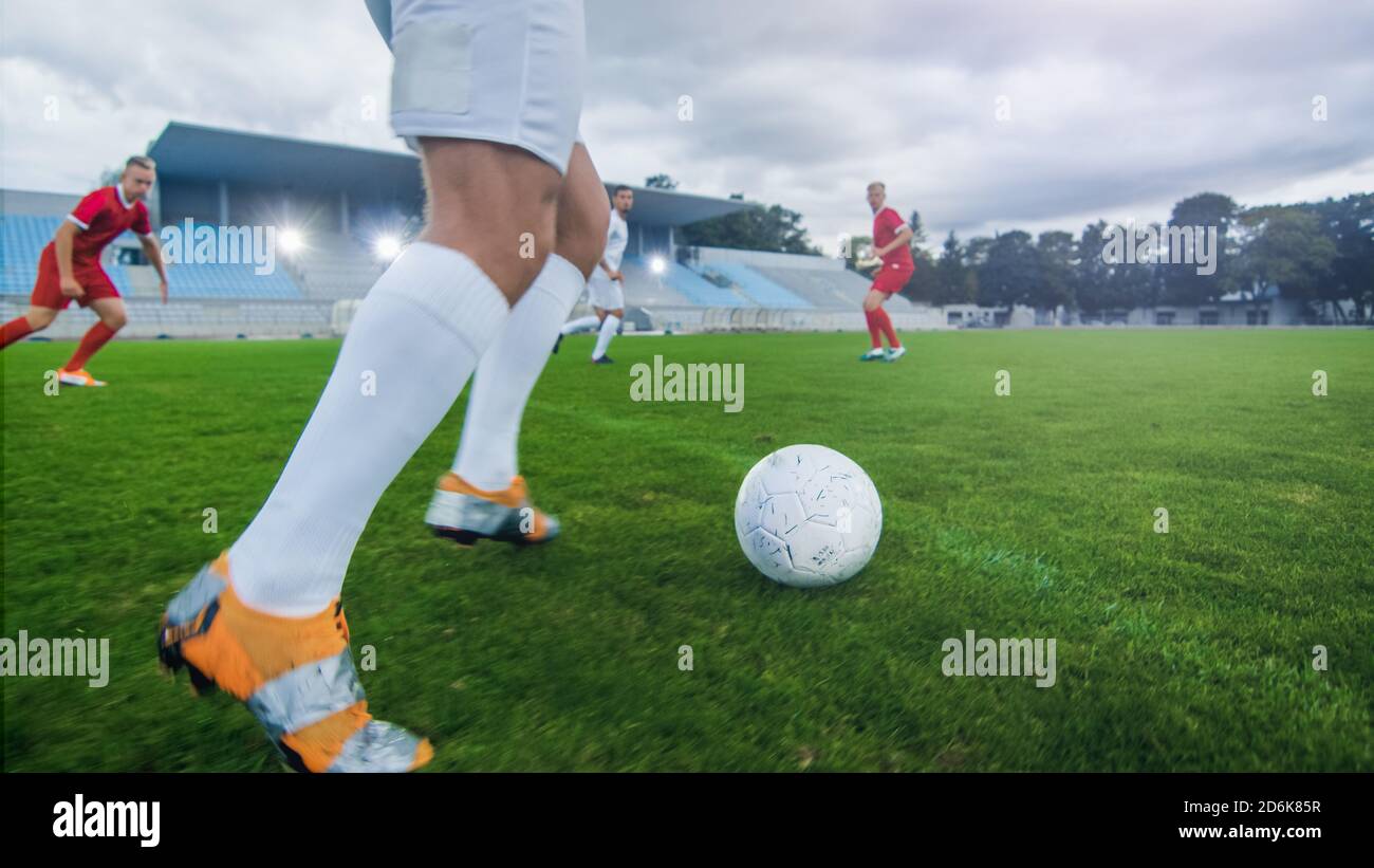 Low Angle Shot of a Professional Soccer Player Before Kicking the Ball. Two Professional