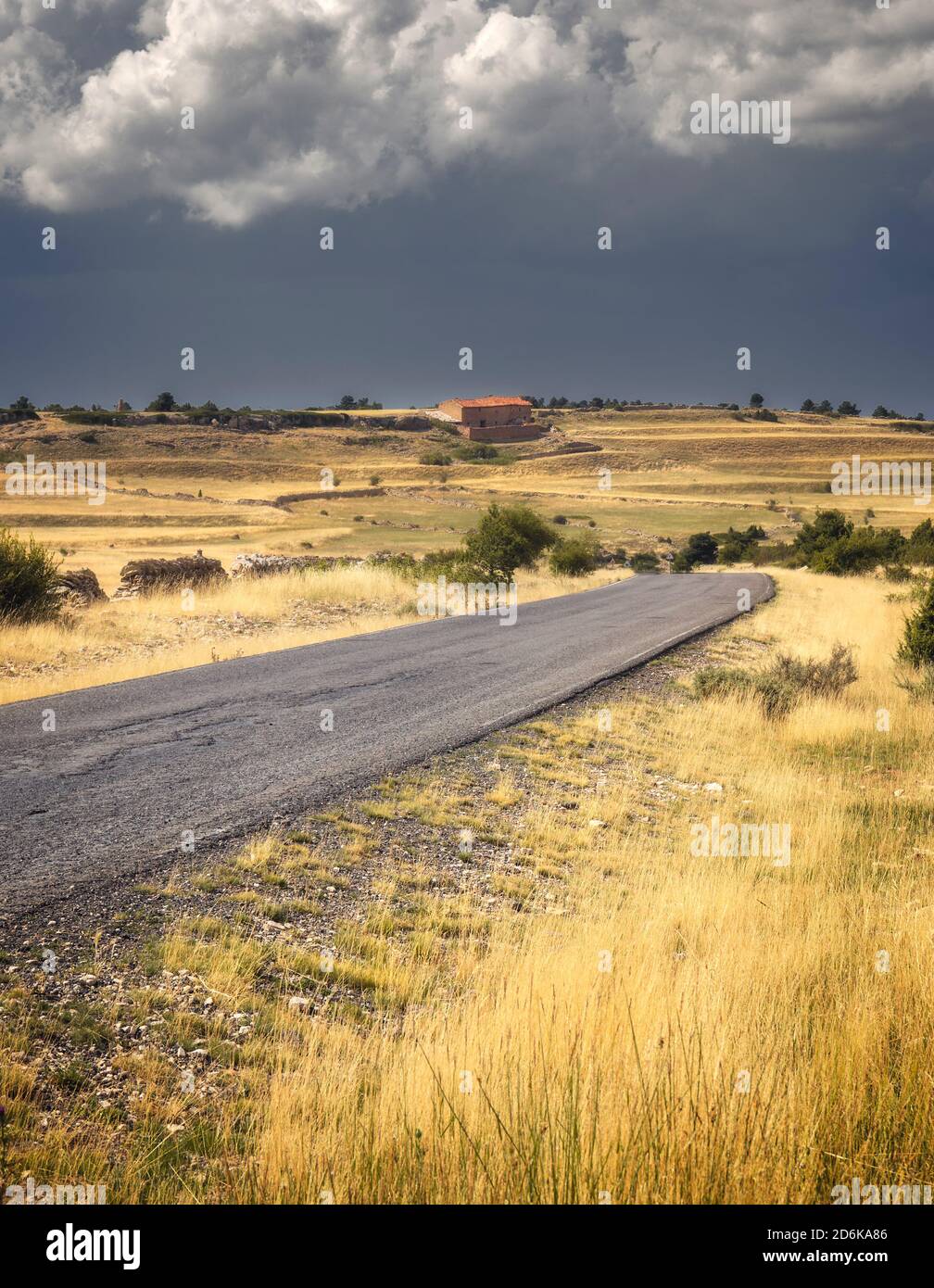 Road Across a Countryside Scene Under Stormy clouds Stock Photo - Alamy