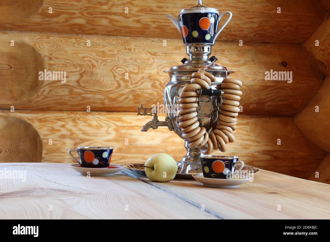 Russian traditional tea-drinking samovar on a wooden table in the sauna Stock Photo