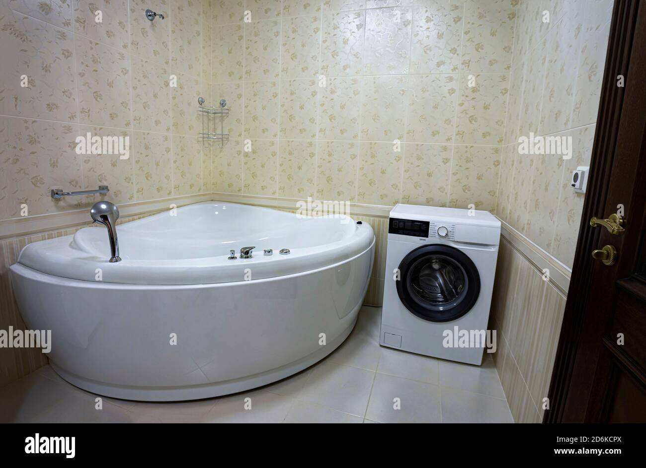 Modern bathroom with jacuzzi bath, copy space Stock Photo - Alamy