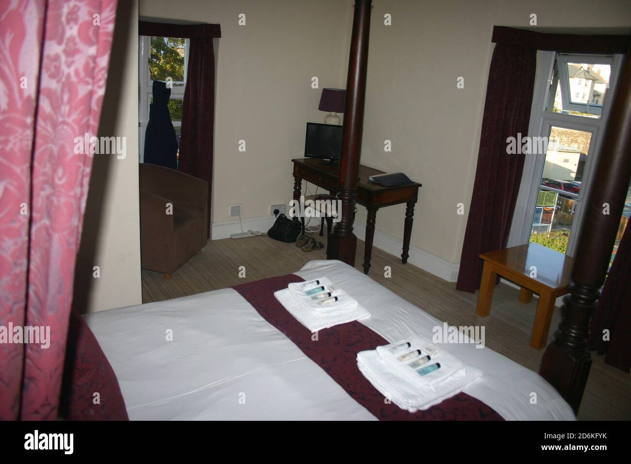Ghost figure in front of window in old hotel room Stock Photo