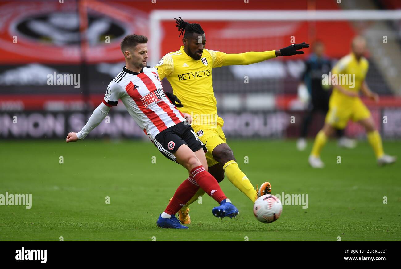 Sheffield United's Oliver Norwood (left) and Fulham's Andre-Frank Zambo Anguissa battle for the ball during the Premier League match at Bramall Lane, Sheffield. Stock Photo