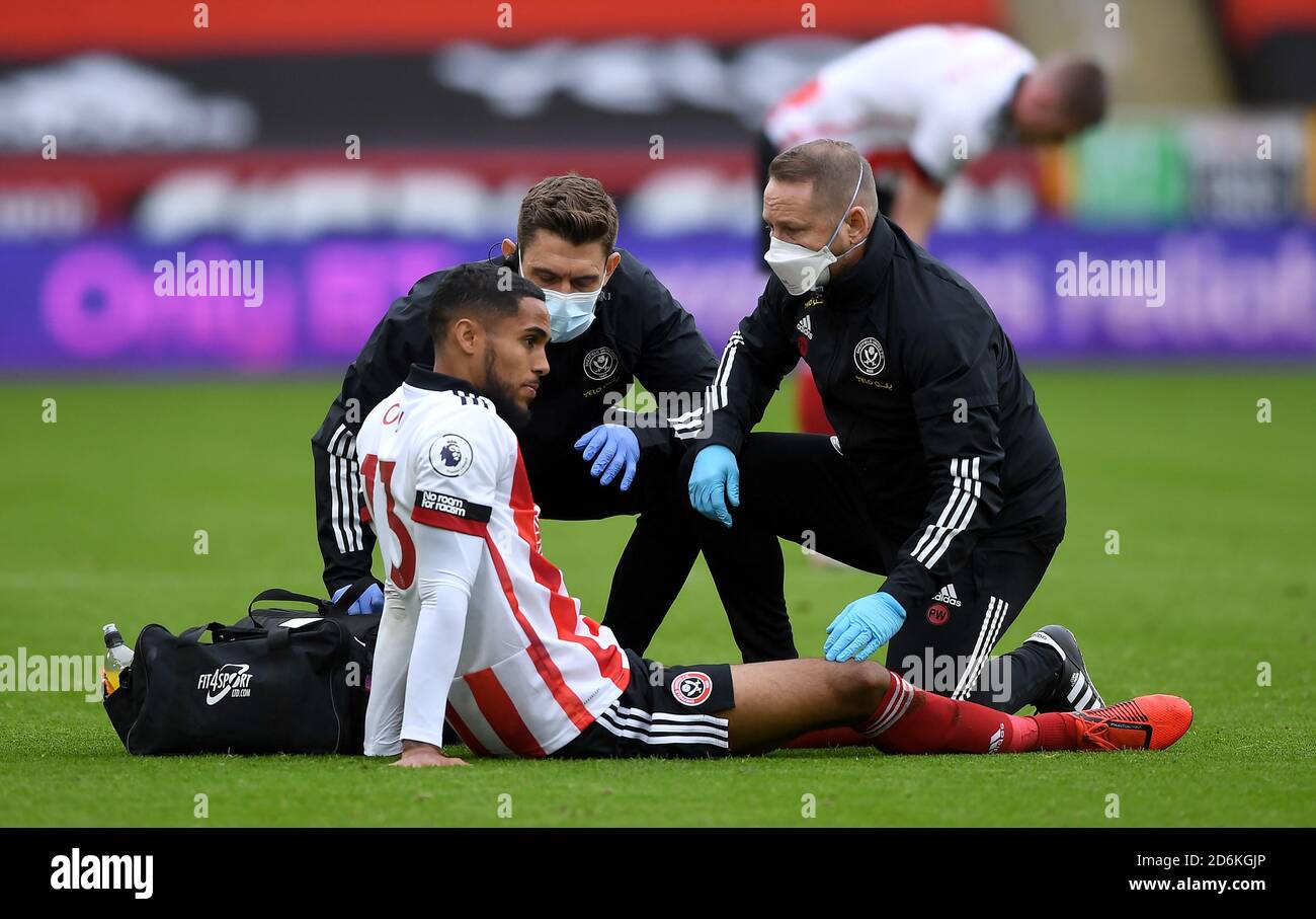 Sheffield United's Max Lowe received treatment for an injury before leaving the game during the Premier League match at Bramall Lane, Sheffield. Stock Photo