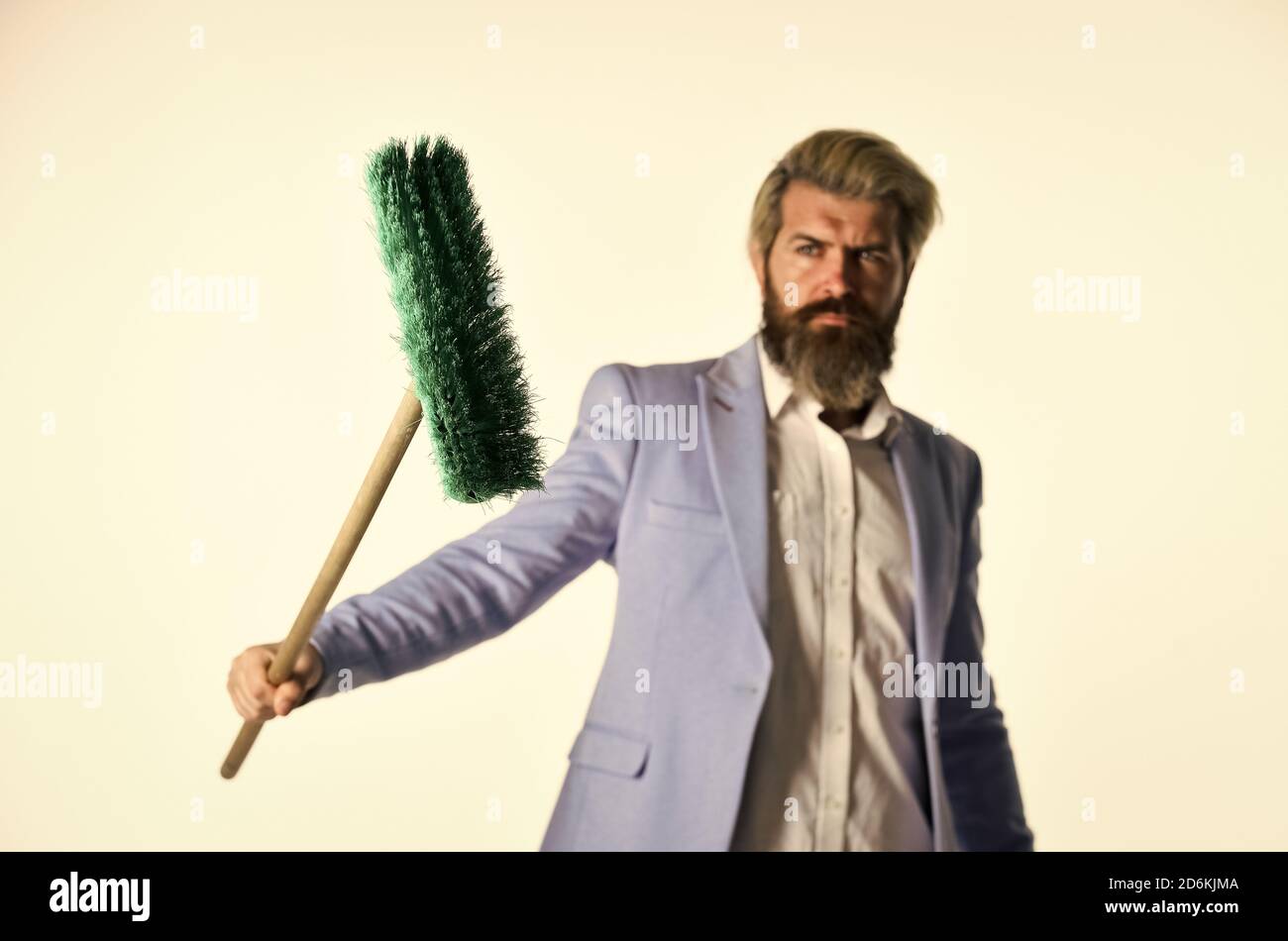 Qualified. Personnel shifts. New responsibilities. Demotion concept. Crisis and unemployment. I agree to any work. Businessman hold broom. Financial crisis concept. Global crisis and unemployment. Stock Photo