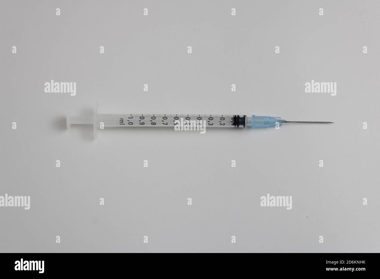 syringe with needle with blue medicine isolated on white background Stock Photo