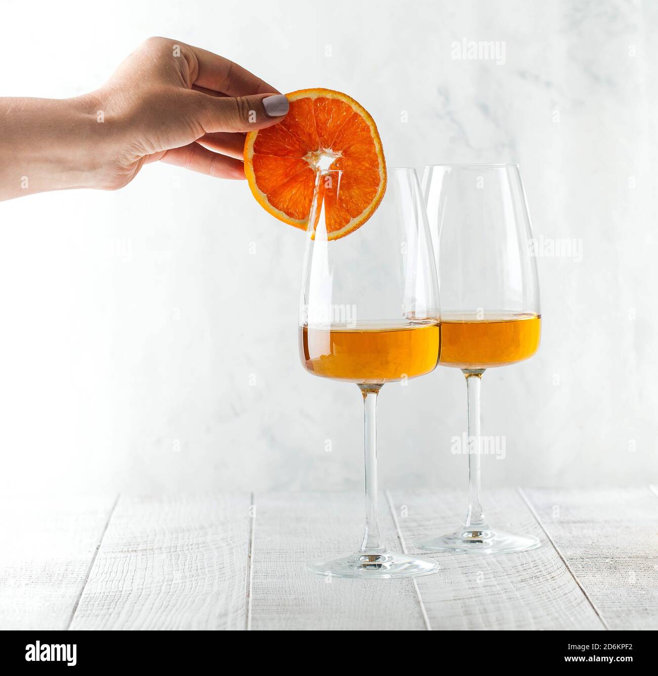 Two glass glasses of orange wine. The concept of a winery, wine shop. Copy space Stock Photo