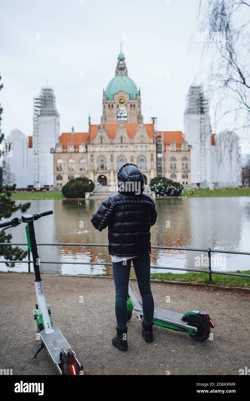 Young girl in Mash Park against the background of the New Town Hall